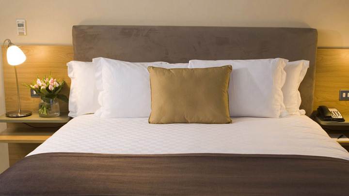 Front Closeup Of White And Brown Bed Side Lamps